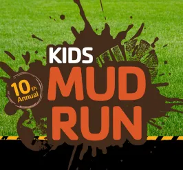 A boot print in a puddle of mud. 10th annual kids mud run. 