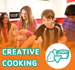 4 young adults assembling ingredients in a kitchen.
