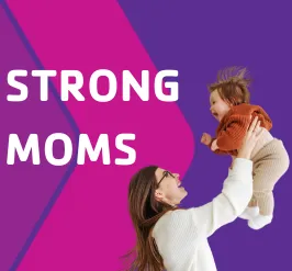 A mom lifting her smiling baby up in the air.
