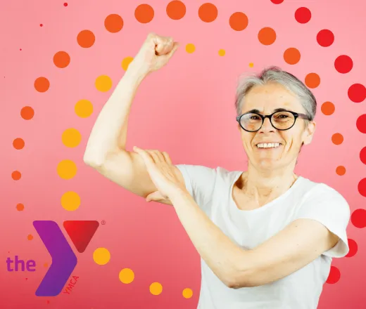 An older woman in a t-shirt showing off her toned upper arms.