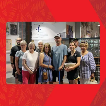 a group photo of Greg and his family at the 20th Ave Y.