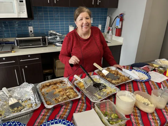 A presenter in the teaching kitchen with her delicious meal.