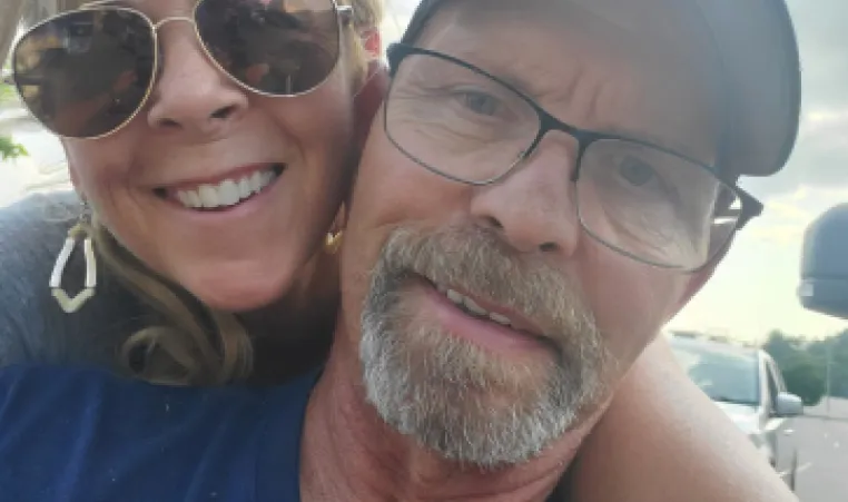 A photo of Greg and his wife.