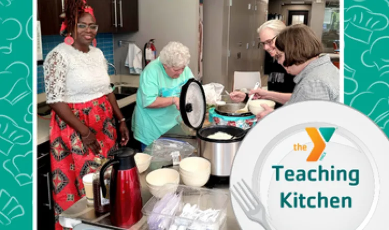 a group of people trying new foods in the teaching kitchen.