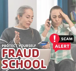 An older woman and her daughter looking distressed over her computer. 