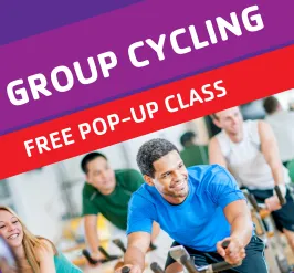 Group Cycling: a free pop-up class. A man on an exercise bike.