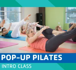 Women stretching on yoga mats.