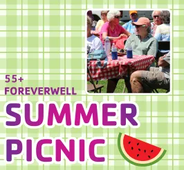 A group of people at a picnic table. 