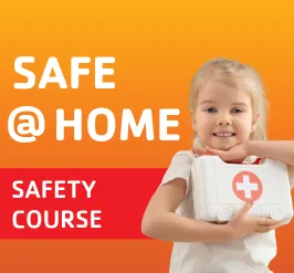 A little girl holding a first aid kit. 