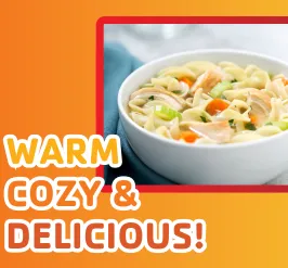 A hot bowl of traditional chicken noodle soup. The text reads "cozy, warm, and delicious!"