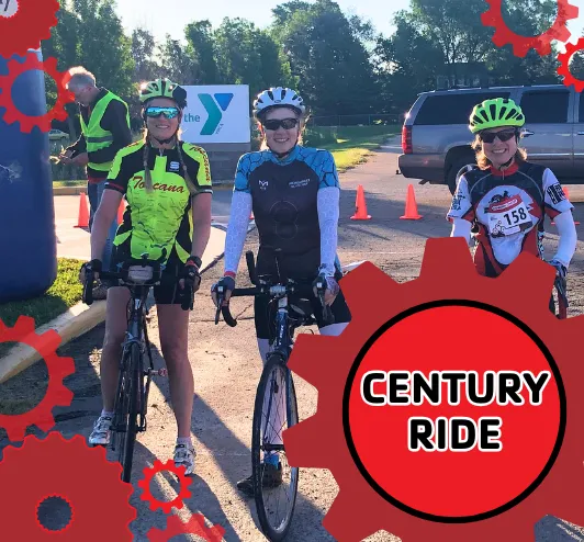 a photo of the starting line of the century ride with smiling bikers.