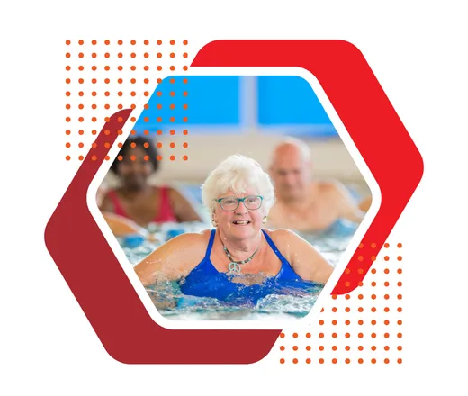 an older adult exercising in the pool.