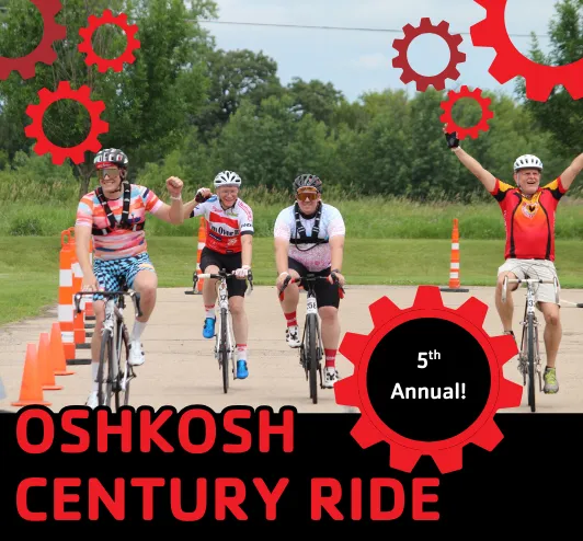 Riders biking through the finish line.