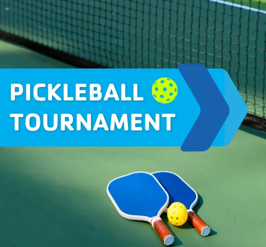 A pickleball court with paddles and balls.