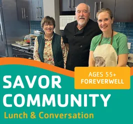3 people cooking in the teaching kitchen.