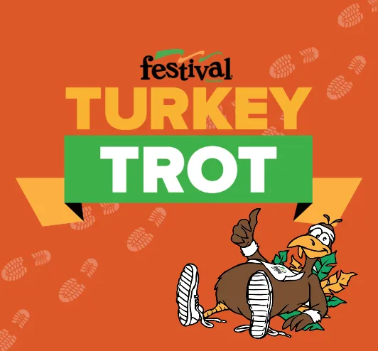 Festival Foods Turkey Trot. Boomer the Turkey giving a thumbs up.