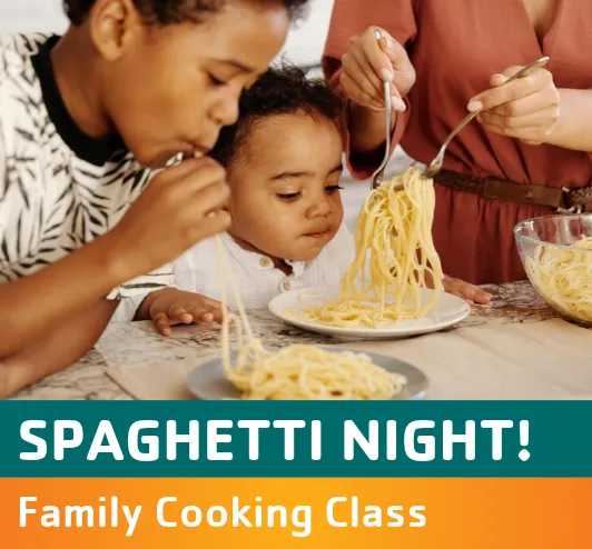 Two little boys eating spaghetti with their mom.