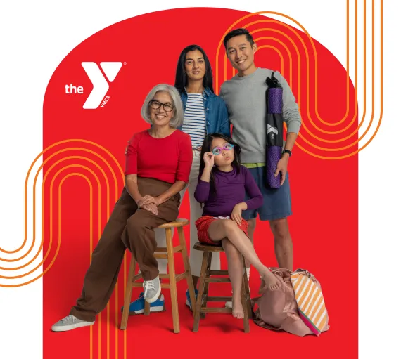 A mom and dad holding a Y bag, a grandmother, and a child wearing swim goggles.