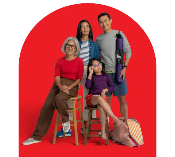 A mom and dad holding a Y bag, a grandmother, and a child wearing swim goggles.
