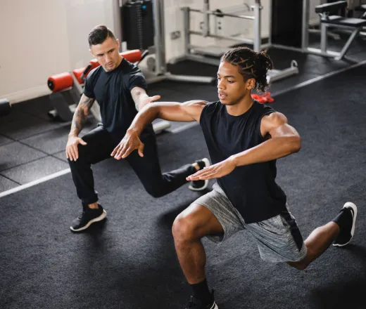 Member working with a personal trainer