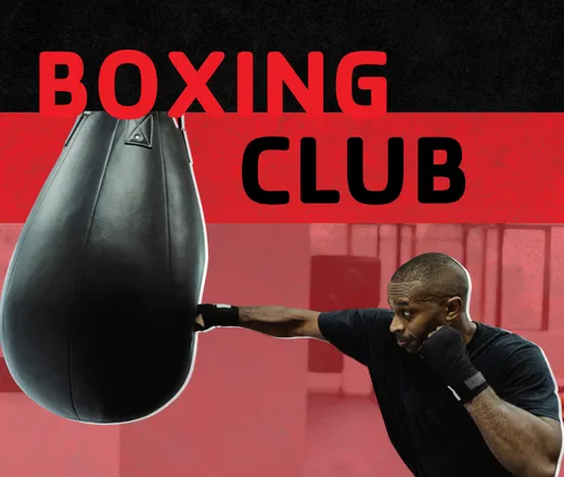 Boxing club: a man hitting a punching bag.