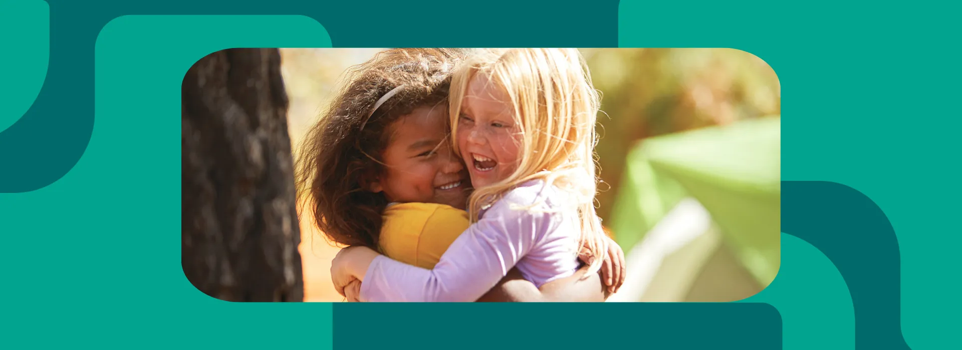 Two little girls hugging.
