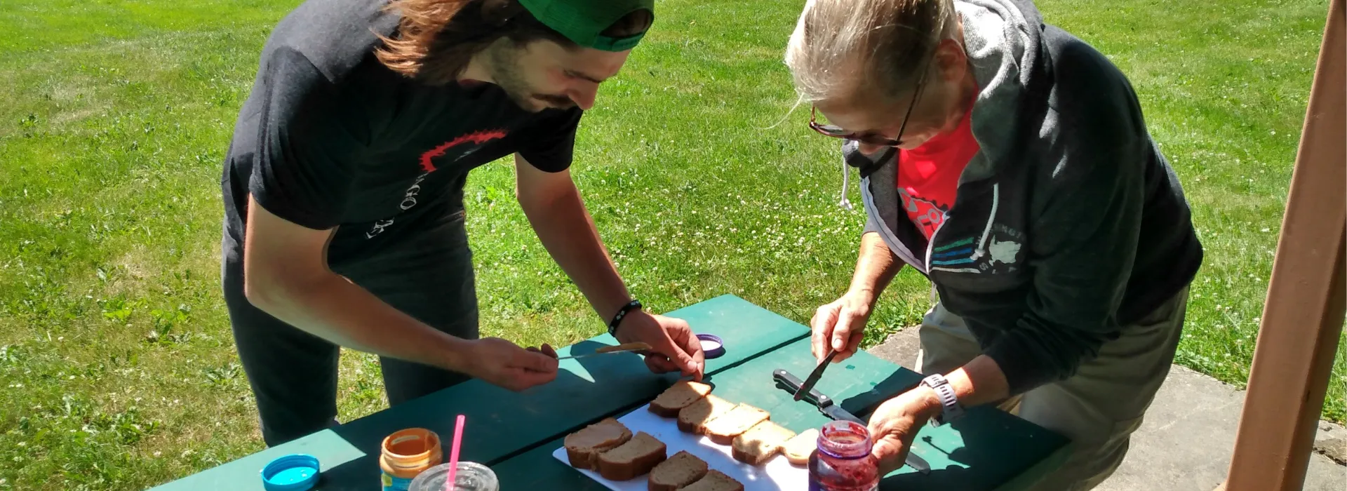 Two volunteers making PB&amp;Js for century ride cyclists.