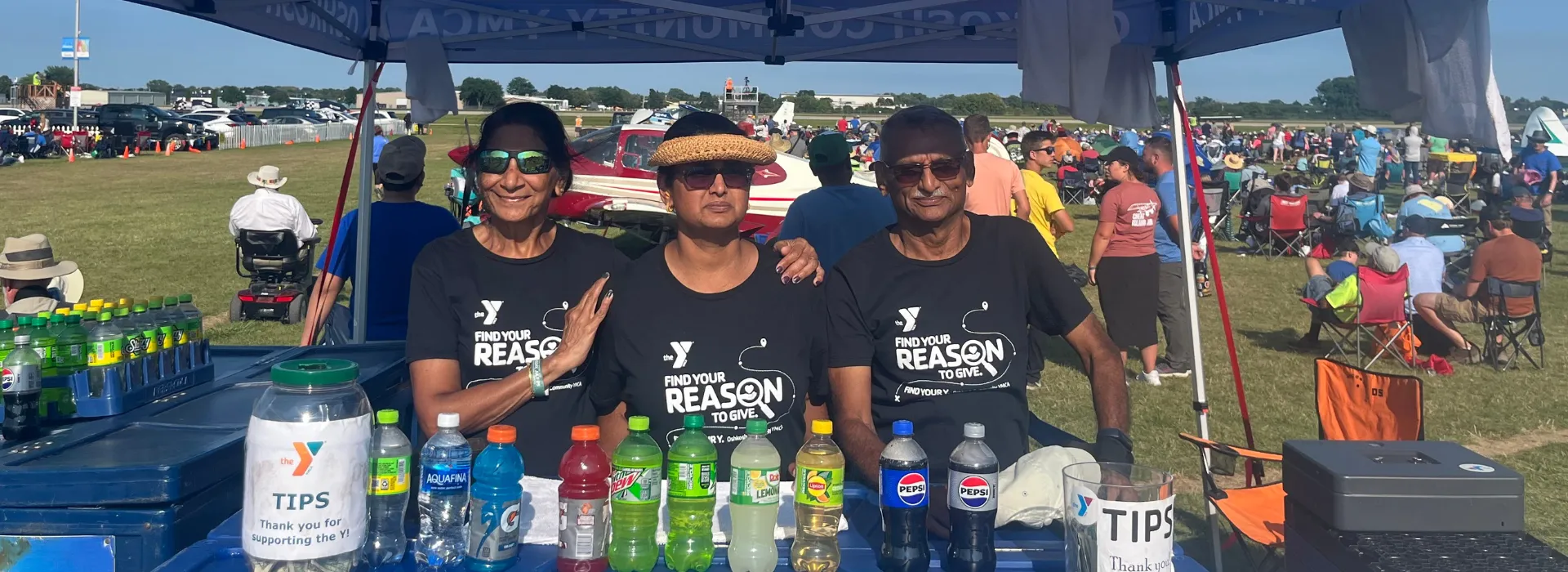 A family volunteering at the EAA beverage cart.