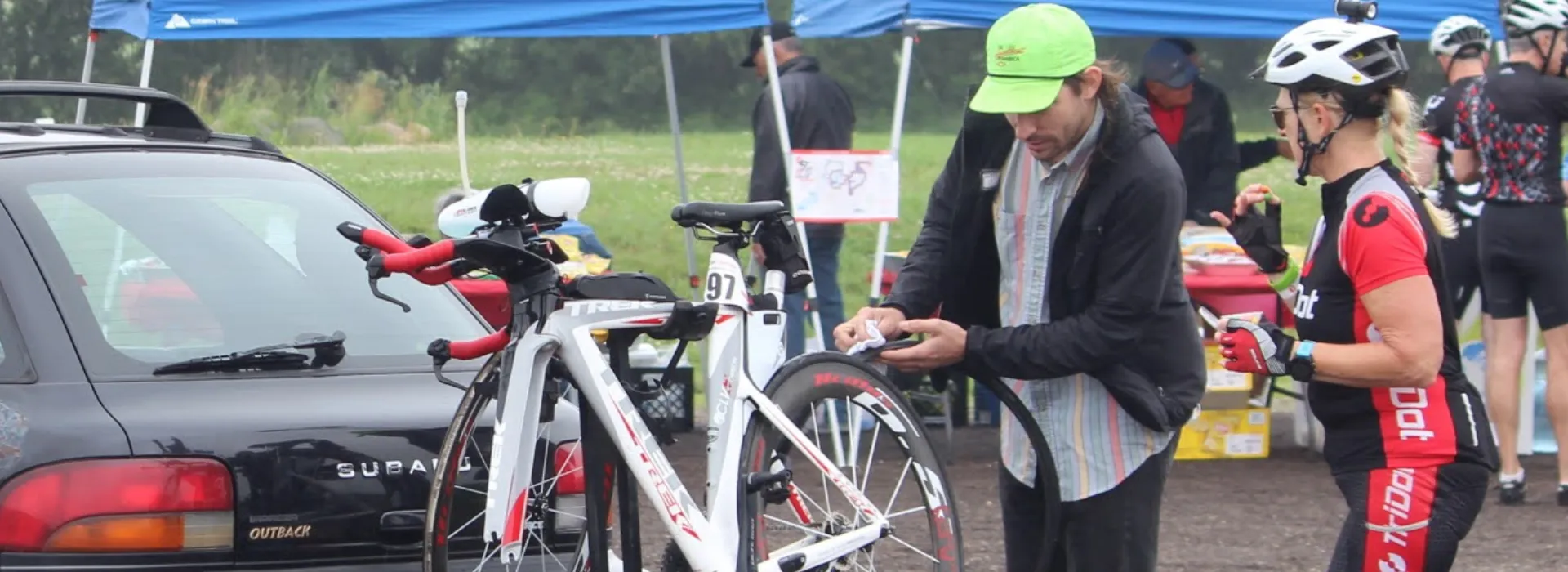A volunteer mechanic fixing a bike at the century ride.