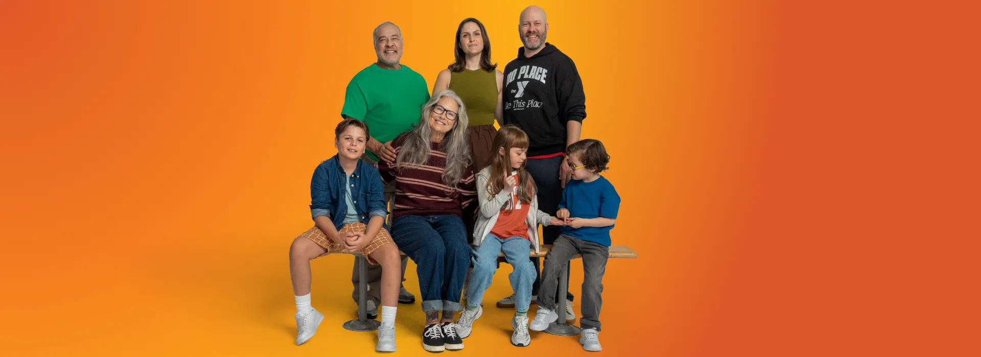 A group of kids, parents, and older adults at the Y.