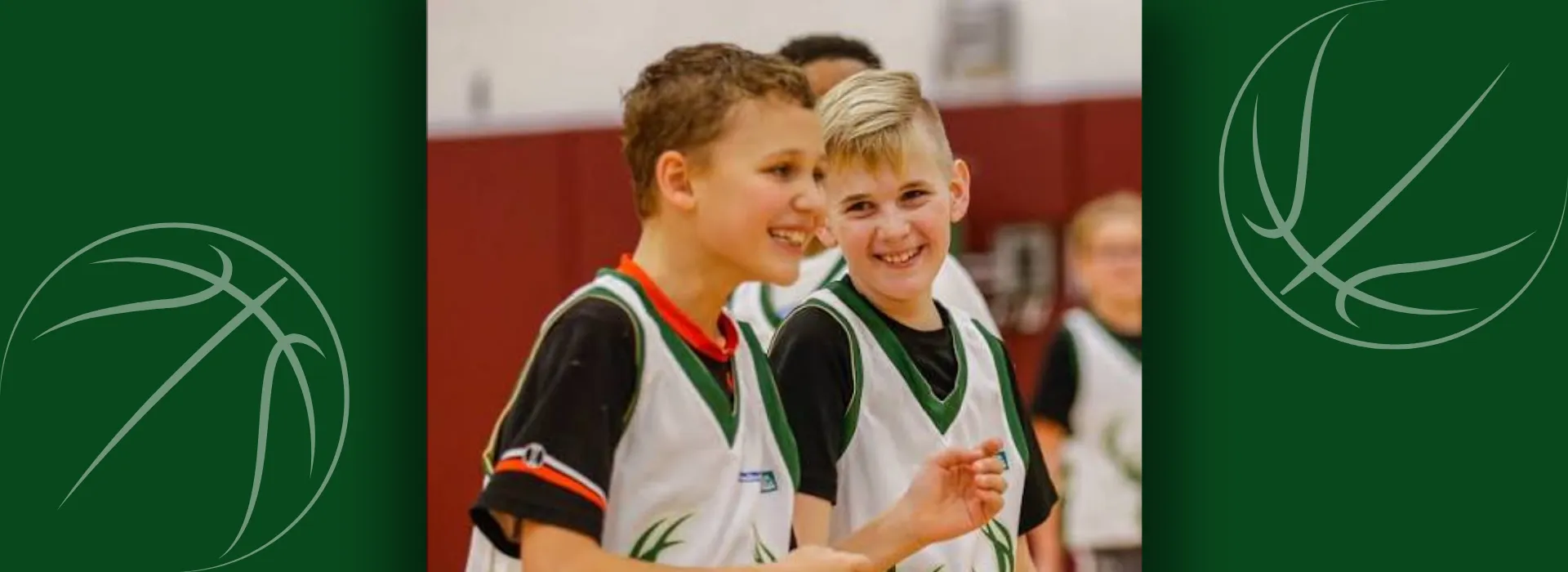 Two kids playing basketball.