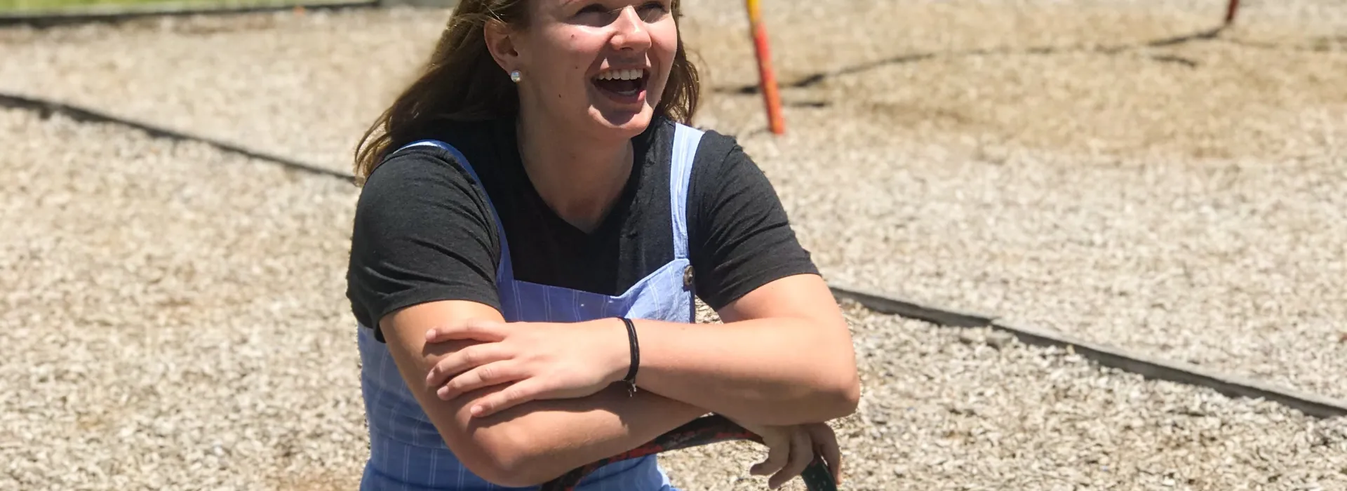 A teen girl on a see-saw.